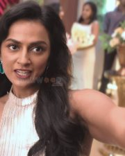Elegant Shraddha Srinath in a Shimmery Gold High Neck Sleeveless Dress Pictures 01