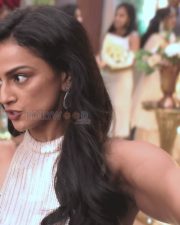 Elegant Shraddha Srinath in a Shimmery Gold High Neck Sleeveless Dress Pictures 02