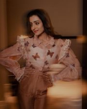 Elegant Trisha Krishnan in a Pastel Pink Outfit with Butterflies and Ruffled Sleeves Photos 02