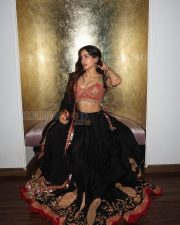 Enchanting Actress Janhvi Kapoor in a Pink Embroidered Blouse and Black Lehenga Photos 03
