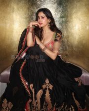 Enchanting Actress Janhvi Kapoor in a Pink Embroidered Blouse and Black Lehenga Photos 04