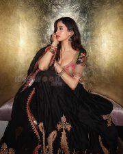 Enchanting Actress Janhvi Kapoor in a Pink Embroidered Blouse and Black Lehenga Photos 06