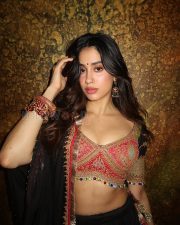 Enchanting Actress Janhvi Kapoor in a Pink Embroidered Blouse and Black Lehenga Photos 08