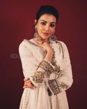 Enchanting Actress Kajal Aggarwal in a White Floral Embroidered Anarkali Suit Photos 01
