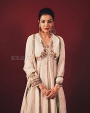 Enchanting Actress Kajal Aggarwal in a White Floral Embroidered Anarkali Suit Photos 02