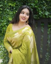 Enchanting Actress Malavika Menon in a Olive Gold Silk Saree Photos 03