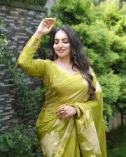 Enchanting Actress Malavika Menon in a Olive Gold Silk Saree Photos 04