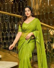 Enchanting Actress Malavika Menon in a Olive Green Silk Saree Photos 07