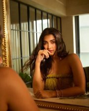Enchanting Actress Pooja Hegde in a Olive Green Lace Strapless Gown Photos 02