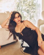 Enchanting Neha Sharma in a Black Lace Trim and Ruffled Mini Dress with a Front Lace Up Tie Detail Photos 02