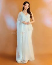 Enchanting Nora Fatehi in a Ivory Net Embroidered Bead Plunge V Geometric Short Kurta Sharara Set Photos 04