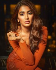 Enchanting Pooja Hegde in an Orange Ribbed Thigh Slit Dress Pictures 03