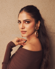 Enigmatic Actress Malavika Mohanan in a Dark Brown Off Shoulder Ribbed Top Photos 02