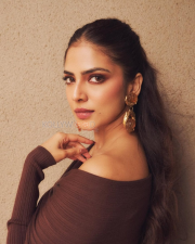 Enigmatic Actress Malavika Mohanan in a Dark Brown Off Shoulder Ribbed Top Photos 02