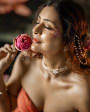 Entrancing Payal Rajput Cleavage in a Orange Drape Saree With Pearl Accessories Photos 02