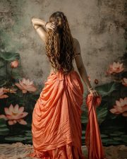 Entrancing Payal Rajput Cleavage in a Orange Drape Saree With Pearl Accessories Photos 03