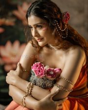 Entrancing Payal Rajput Cleavage in a Orange Drape Saree With Pearl Accessories Photos 04
