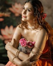 Entrancing Payal Rajput Cleavage in a Orange Drape Saree With Pearl Accessories Photos 09