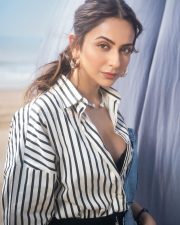 Fashionable Rakul Preet Singh in a Black and White Striped Denim Shirt with a Black Bralette and Fitted Pencil Skirt Pictures 02