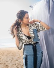 Fashionable Rakul Preet Singh in a Black and White Striped Denim Shirt with a Black Bralette and Fitted Pencil Skirt Pictures 03