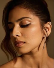 Glam Malavika Mohanan in a Golden Corset Top with a Black Slit Skirt Photos 03