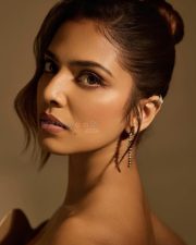 Glam Malavika Mohanan in a Golden Corset Top with a Black Slit Skirt Photos 04