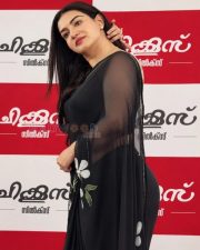 Glamorous Actress Honey Rose in a Black Chiffon Saree With White Floral Applique Photos 03