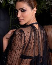 Glamorous Actress Kriti Sanon in a Black Deep V Beaded Gown Photos 02