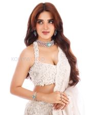 Glamorous Actress Nidhhi Agerwal in a White Embroidered Lehenga Photos 03