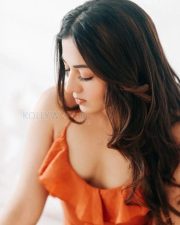 Glamorous Catherine Tresa in an Orange High Slit Bodycon Dress showcasing her Toned Thighs Photos 01