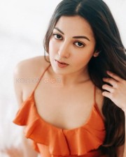 Glamorous Catherine Tresa in an Orange High Slit Bodycon Dress showcasing her Toned Thighs Photos 02