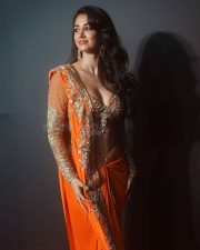 Glamorous Disha Patani in a Vibrant Orange Saree with a Plunging Neckline Blouse at MAMI Film Festival Photos 03