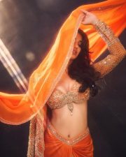 Glamorous Disha Patani in a Vibrant Orange Saree with a Plunging Neckline Blouse at MAMI Film Festival Photos 04