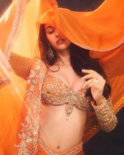 Glamorous Disha Patani in a Vibrant Orange Saree with a Plunging Neckline Blouse at MAMI Film Festival Photos 07