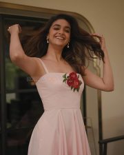 Glamorous Keerthy Suresh in a Light Pink Strappy Gown with a Red Rose Photos 02