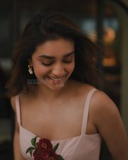 Glamorous Keerthy Suresh in a Light Pink Strappy Gown with a Red Rose Photos 04