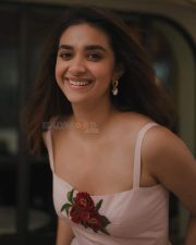 Glamorous Keerthy Suresh in a Light Pink Strappy Gown with a Red Rose Photos 05