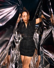 Glamorous Malaika Arora in a Sleek Black Mini Dress Pictures 04