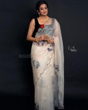 Glamorous Priyamani in a White Transparent Saree with Black Sleeveless Blouse Pictures 01
