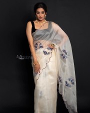 Glamorous Priyamani in a White Transparent Saree with Black Sleeveless Blouse Pictures 02