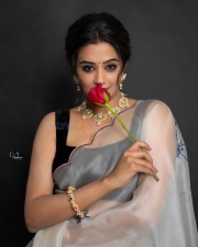 Glamorous Priyamani in a White Transparent Saree with Black Sleeveless Blouse Pictures 05
