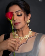 Glamorous Priyamani in a White Transparent Saree with Black Sleeveless Blouse Pictures 07