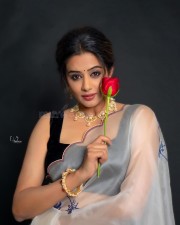 Glamorous Priyamani in a White Transparent Saree with Black Sleeveless Blouse Pictures 08