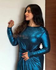 Glittering Actress Malavika Menon in a Teal Metallic Long Sleeve Dress Photos 01
