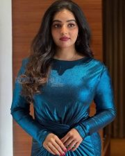 Glittering Actress Malavika Menon in a Teal Metallic Long Sleeve Dress Photos 04