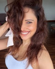 Glowing Actress Nushratt Bharucha in a White Ribbed Scoopneck Tank Top Photos 01