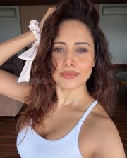 Glowing Actress Nushratt Bharucha in a White Ribbed Scoopneck Tank Top Photos 02