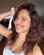 Glowing Actress Nushratt Bharucha in a White Ribbed Scoopneck Tank Top Photos 03