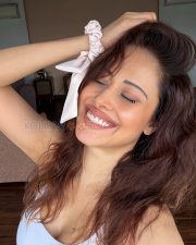 Glowing Actress Nushratt Bharucha in a White Ribbed Scoopneck Tank Top Photos 04