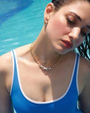 Glowing Actress Tamanna Bhatia in a Blue and White Swimsuit Photos 02